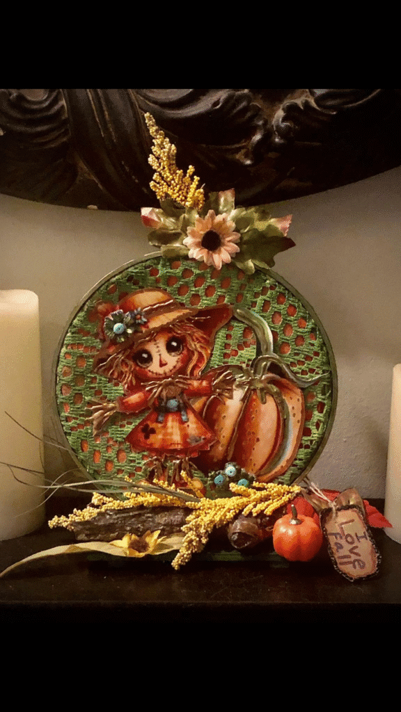 DIY scarecrow fall plate decor with lace background, faux flowers, small pumpkin, and Love Fall sign