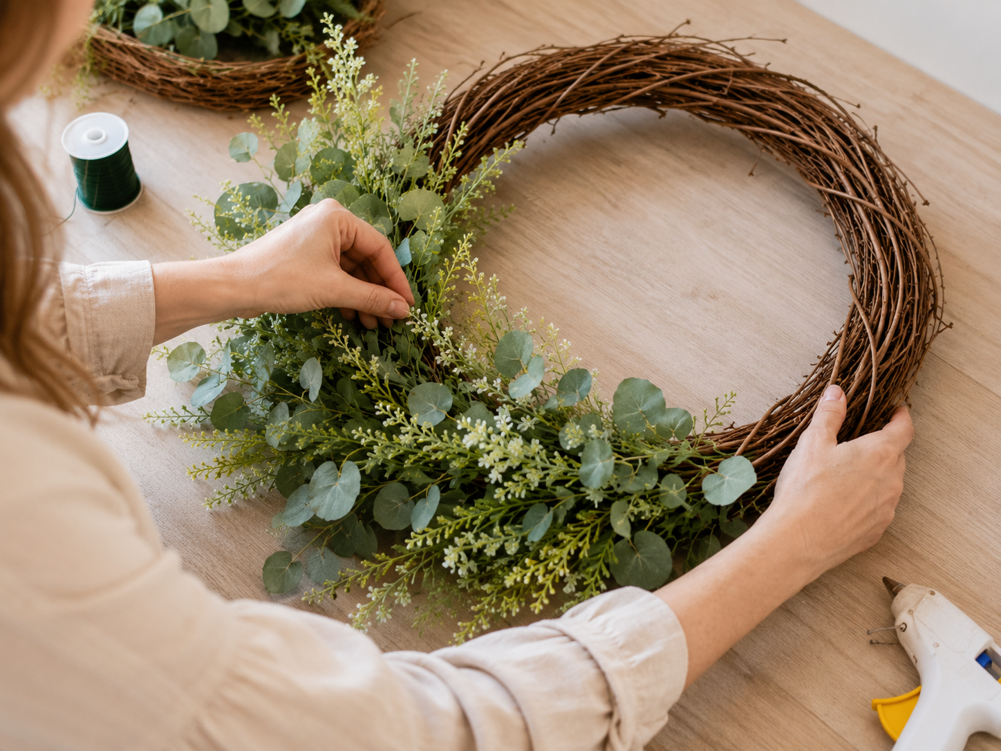How to establish the greenery base - Boutique-Style Dollar Tree Summer Lemon & Daisy Wreath DIY tutorial