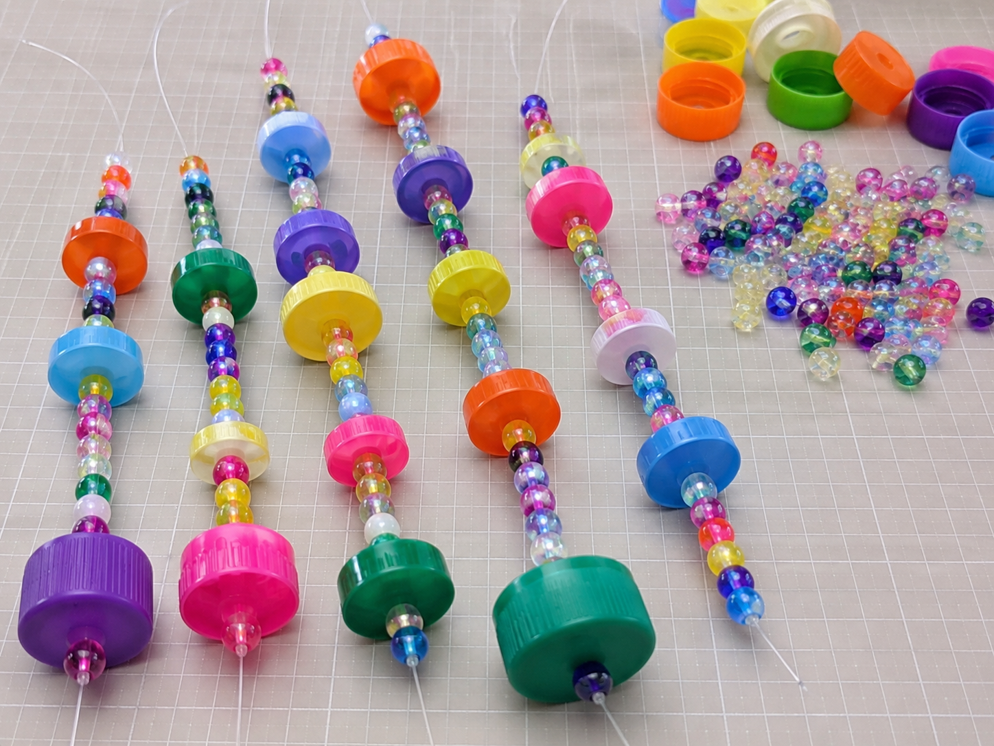How to assemble hanging strands - Cheerful Upcycled Bottle Cap Wind Chime DIY tutorial