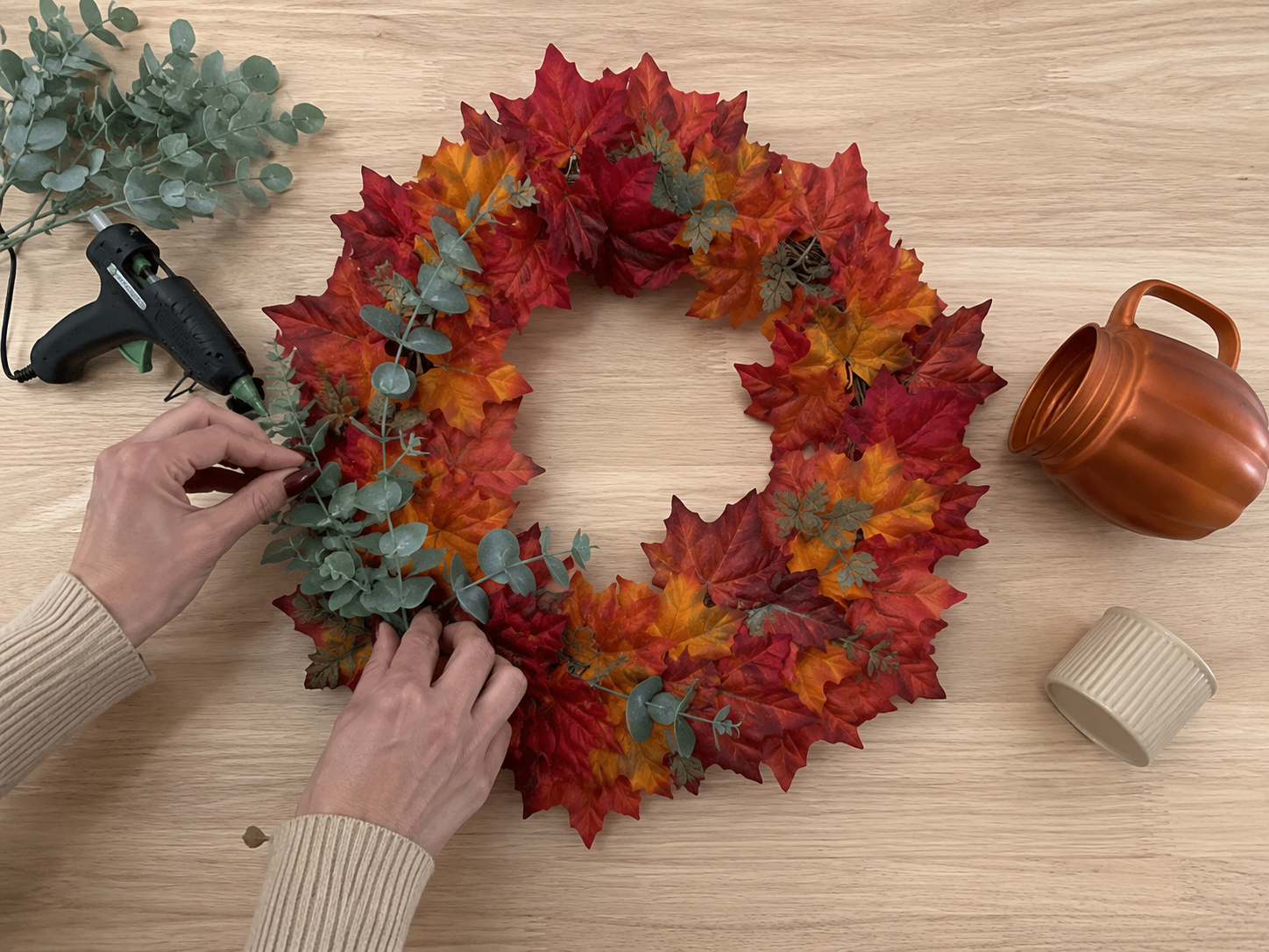 How to layer in muted eucalyptus - Harvest Haven Wreath: A Dollar Tree-Style Fall Statement DIY tutorial