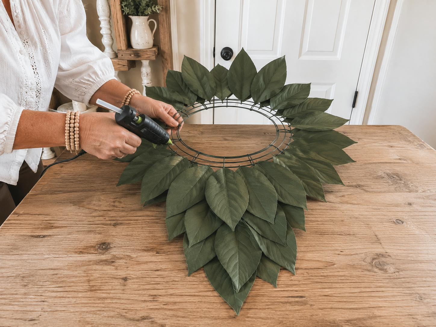 How to attach back green leaves - Rustic Layered Flower Door Hanger: Farmhouse Charm on a Budget! DIY tutorial
