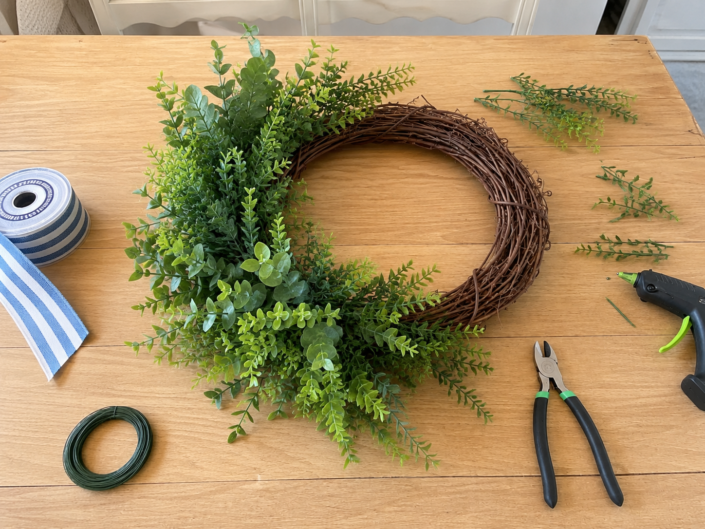 How to trim & lay out greenery - Sunshine & Stripes: Easy Dollar Tree Summer Wreath DIY tutorial