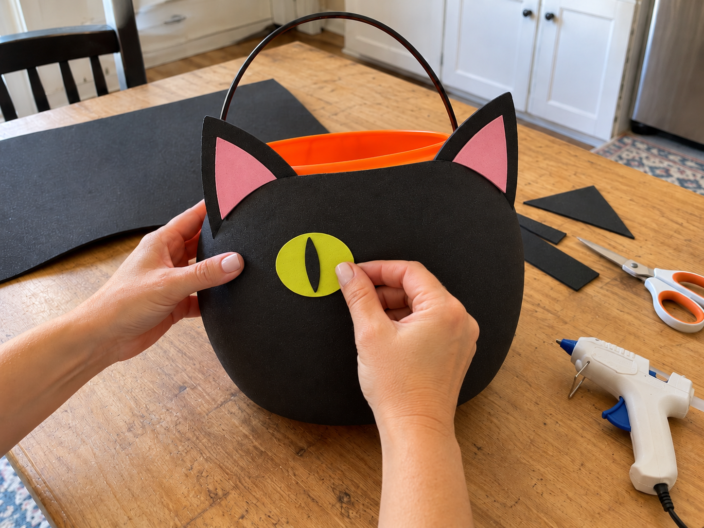 DIY Black Cat Foam Trick-or-Treat Bucket for Halloween Candy, step 3: Add the Eyes