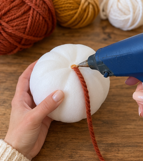 DIY Yarn-Wrapped Foam Pumpkins with Twig Stems for Fall Decor, step 2: Secure Yarn and Start Wrapping